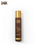 Brown spray tan bottle with gold cap on a white background