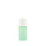 Green skincare bottle with white cap on a white background