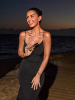 Close-up of model’s shoulder after applying Bronze Elixir