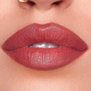 Woman applying KASH Devotion lipstick