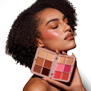 Woman holding a sosu-cream-complexion-palette-dark-with-a-neutral-background