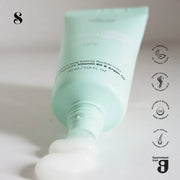 Green skincare product tube with brand logo and text on a light background