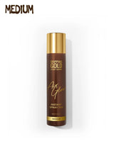 Brown spray tan bottle with gold cap on a white background