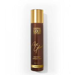 Brown spray tan bottle with gold cap on a white background