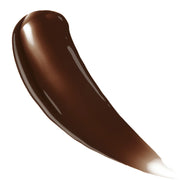 Close-up of the pump and tanning liquid texture in Dark tone