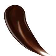 Model holding BAHAMA BODY Ultra Dark tanning liquid