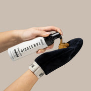 Applying tanning mousse to the Annalivia mitt