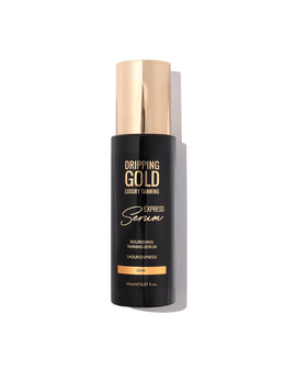 Dripping Gold luxury tanning serum bottle on a white background