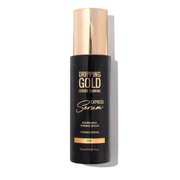 Dripping Gold luxury tanning serum bottle on a white background
