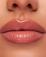 Femme lipstick being applied on lips for a polished look