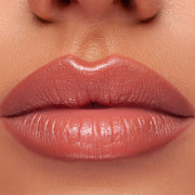 Femme lipstick being applied on lips for a polished look