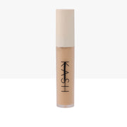 Cosmetic concealer stick with beige color on a white background