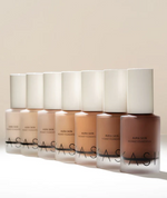 Set of ASAS skincare bottles on a beige background