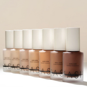 Set of ASAS skincare bottles on a beige background