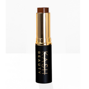 Makeup stick with gold cap and black body on a white background