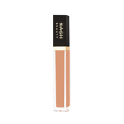 Lip gloss with black and gold packaging on a white background
