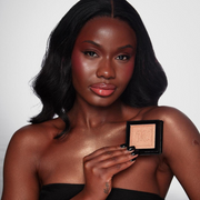 Model wearing KASH Bronze Powder Silk for a warm glow