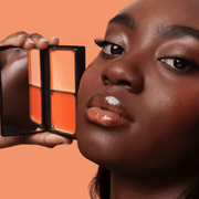 Model with KASH Coral Flush Blush Duo applied on cheeks for a fresh look