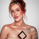 Model applying KASH Champagne Powder Silk for a radiant highlight