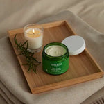Model holding Weleda Skin Food Body Butter
