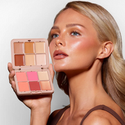 model-holding-a-makeup-palette-with-a-neutral-background