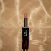 Close-up showing the smooth finish of the True Satin lipstick bullet
