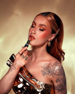 Model wearing a polished look using KASH True Satin Lipstick